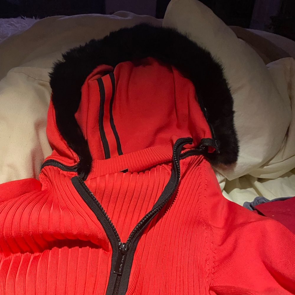 Red and black hooded sweater can zip off hood